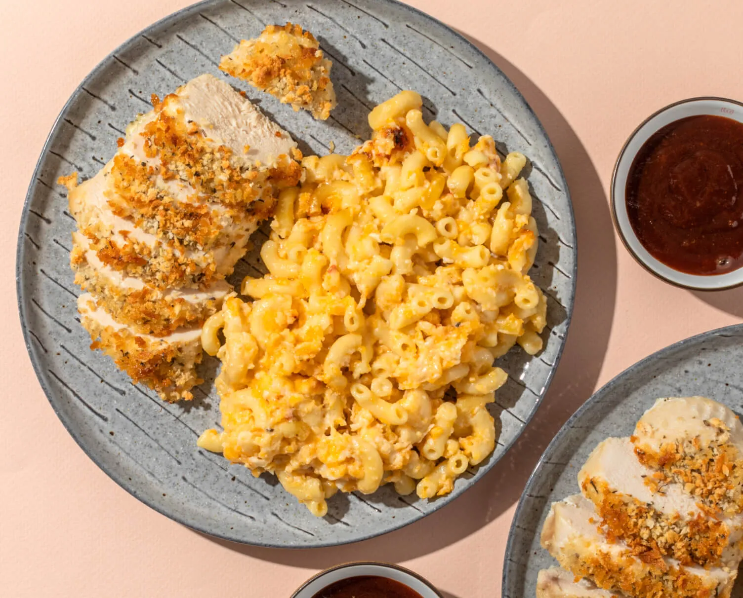 Plate of mac and cheese and panko crusted chicken